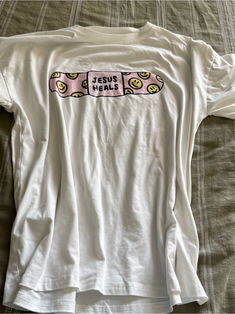 Jesus heals over sized tee